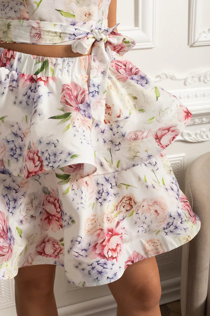 Conjunto – Top Estampado Sem Mangas  + Saia Curta Plissada de Cintura Alta